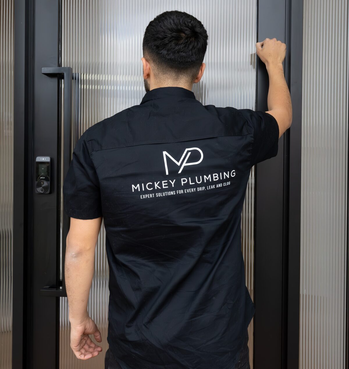 Murat wearing the Mickey Plumbing uniform