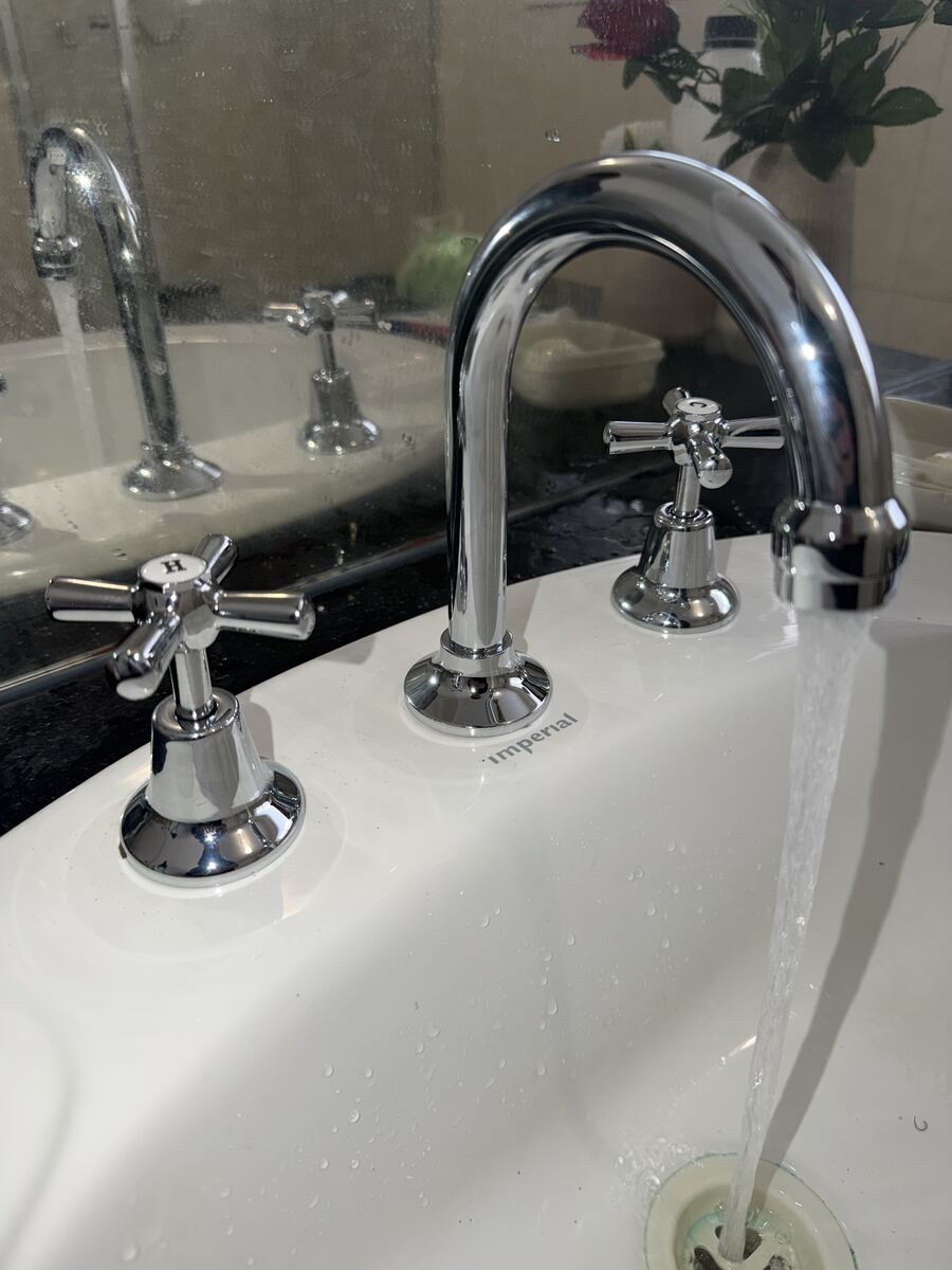 Chrome basin tapware running clear water after a repair